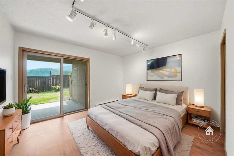 Bedroom 2 - Door to Patio (Virtual Staging)