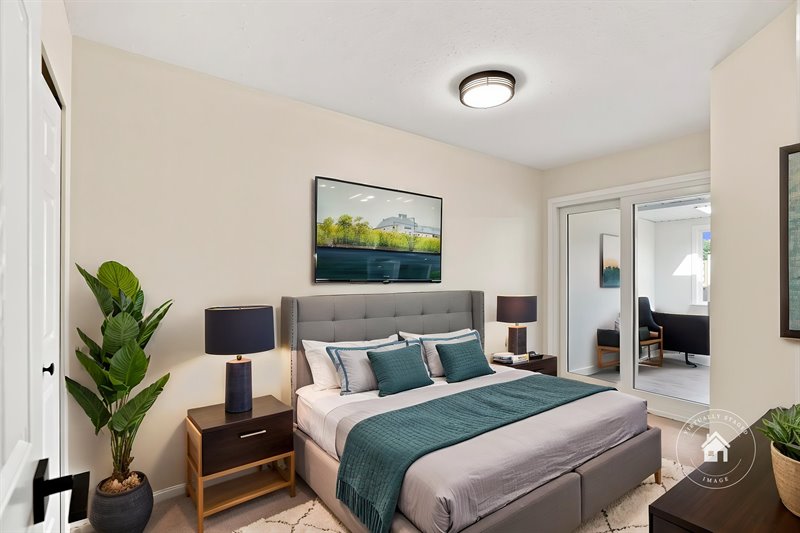 Bedroom 2 - Door to Sun Room (Virtual Staging)